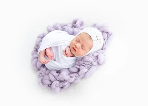 Charming newborn sleeping Stock Photos