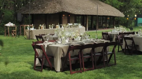 Charming outdoor dining setup for a wedding, featuring beautifully arranged Video stock 308796301