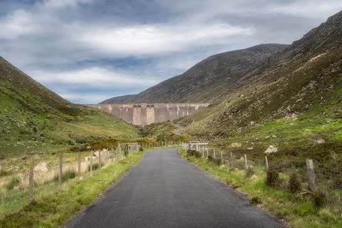 A charming pathway gently winds through an inviting, vibrant Silent Valley Re Stock Photos