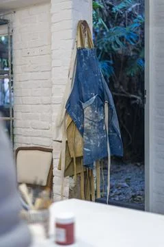 Charming pottery studio showcasing a worn apron ready for creativity Stock Photos