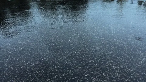 A Charming Rainy Reflection on the Pavement This is a Serene and Tranquil Scene Stock Footage 318544551