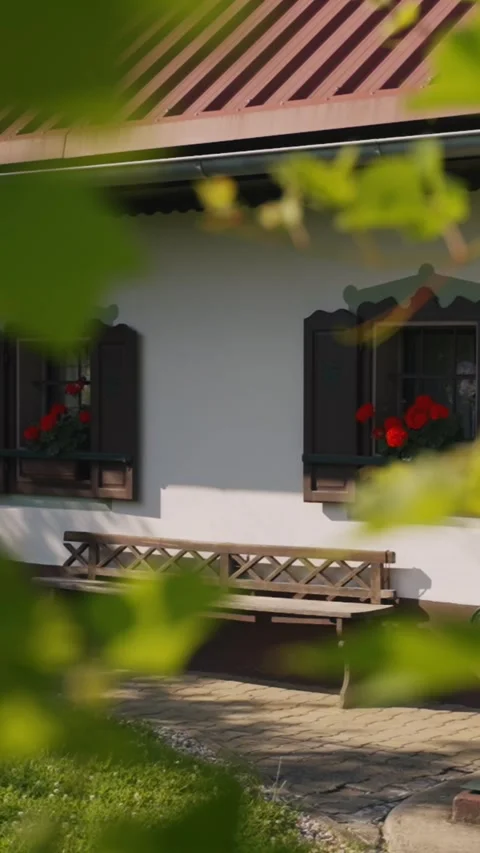 Charming Rustic Cottage Bench with Flowers – Vertical Video for Social &amp; Mobile Stock Footage 339918434