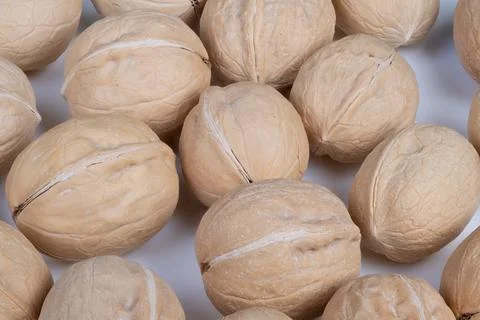 Charming rustic presentation of walnuts in shells for festivities. Inviting c Stock Photos