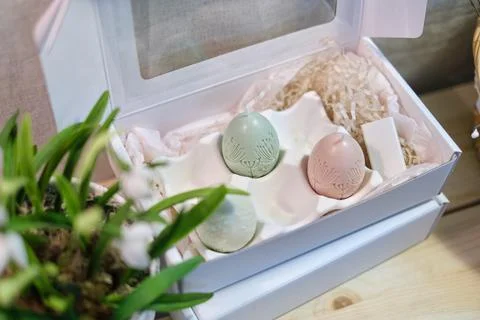 Charming set of Easter-inspired egg candles in a delightful presentation box Stock Photos