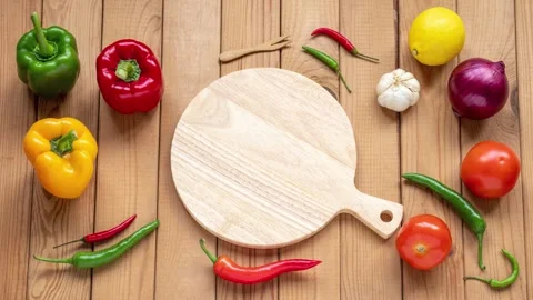 Charming stop motion animation of vegetables and a cutting board Stock Footage 340960541
