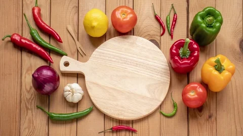Charming stop motion animation of vegetables and a cutting board Stock Footage 340960548