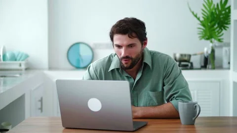 Charming successful young bearded multi-ethnic man expressing stupefaction and Stock Footage 219395862