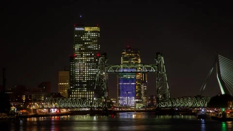 Charming timelapse of Rotterdam's nighttime river view with glowing skyline Stock Footage 309564190