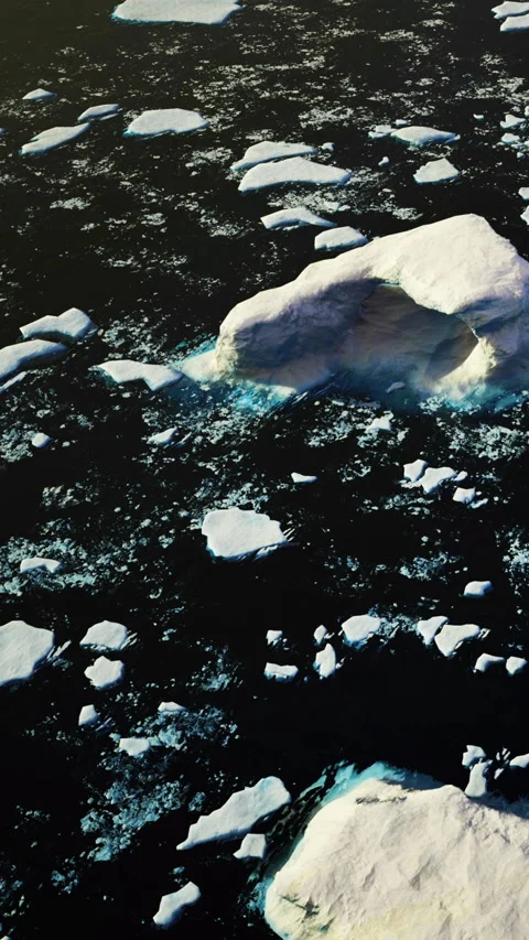 Charming view of scattered ice fragments under a golden light at sea Stock Footage 334251939