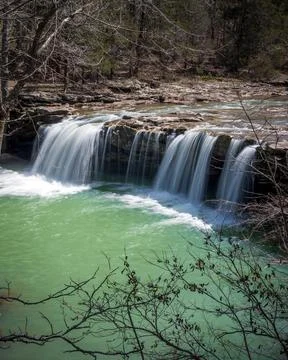 Charming view of a waterfall on the background of a park 스톡 사진