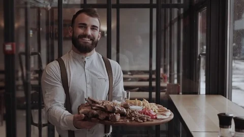 Charming waiter with the beared Stock Footage 85366833
