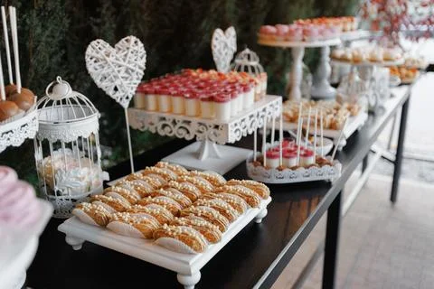 Charming wedding sweets arrangement in soft natural tones Stock Photos