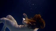 Charming Woman Is Floating Naked Underwater, Stock Footage