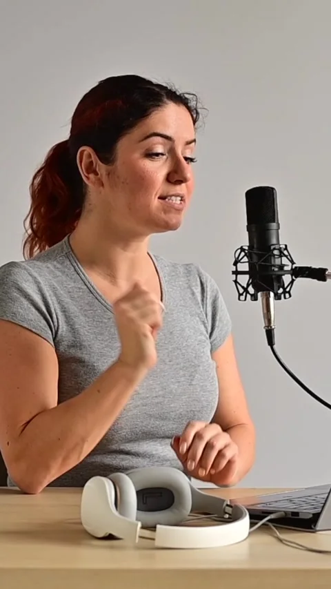 A charming woman radio host is Stock Video Pond5