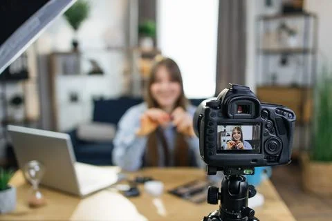 Charming woman recording tutorial about professional makeup 写真素材