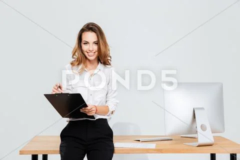 Charming young businesswoman working with documents Stock Photos