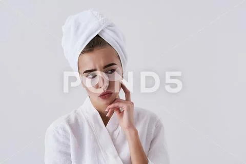 Charming young lady with patches under eyes pouting lips and feeling annoyed Stock Photos