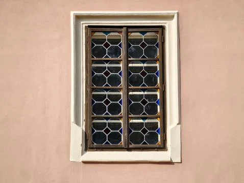 Charmingly aged glass craftsmanship featuring complex leaded motifs and sub.. Stock Photos