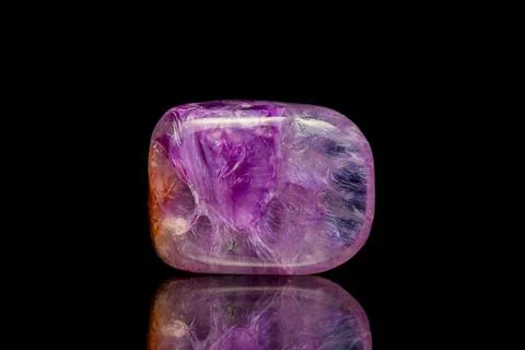 Charoite gemstone on dark background Stock-Fotos