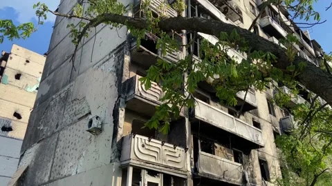 Charred and broken windows after hostilities in the city of Irpin Stock Footage 239436094