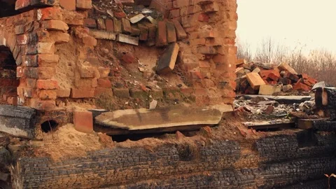 Charred black logs and a destroyed stove, the remains of a burned-out house. Stock Footage 224680051