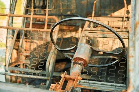 Charred Car Interior Inside Burned Delivery Van with Metal Seat Frames Stock-Fotos
