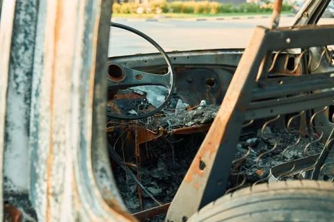 Charred Car Interior Inside Burned Delivery Van with Metal Seat Frames Stock-Fotos