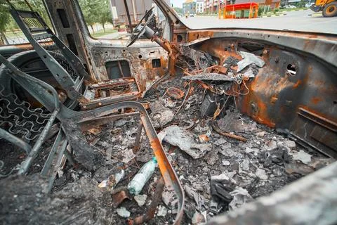 Charred Car Interior Inside Burned Delivery Van with Metal Seat Frames Stock-Fotos