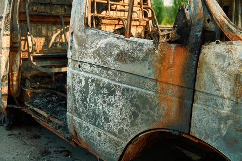 Charred Car Interior Inside Burned Delivery Van with Metal Seat Frames Фото