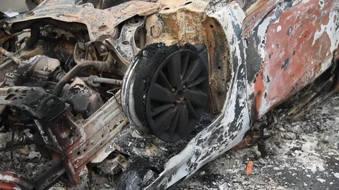 Charred vehicle which was reportedly set on fire by the protesters Video stock 122246157