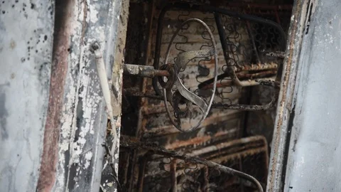 Charred vehicle which was reportedly set on fire by the protesters Video stock 122246300