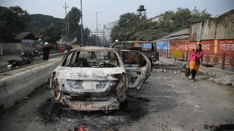 Charred vehicle which was reportedly set on fire by the protesters Video stock 122246504