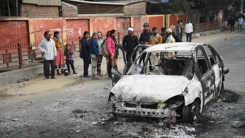 Charred vehicle which was reportedly set on fire by the protesters Video stock 122247102