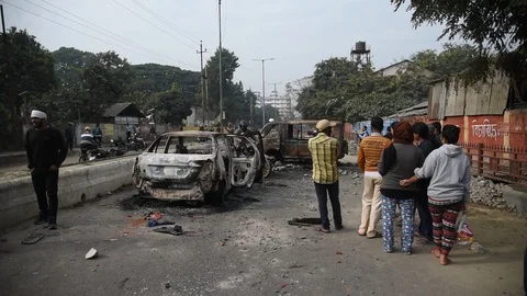 Charred vehicle which was reportedly set on fire by the protesters Video stock 122247115