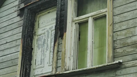 Charred Window Frames and Faded Paint on Abandoned Wooden House – Rural USA Stock Footage 310314969