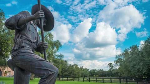 Charro statue with clouds &amp; blue sky timelapse. 12 seconds Stock Footage 204993664