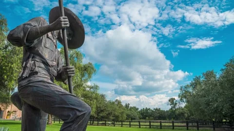 Charro statue with clouds &amp; blue sky timelapse. 24 seconds Video stock 204993858