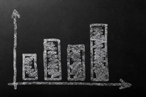 Chart up with bar in white chalk on a dark blackboard. Foto stock