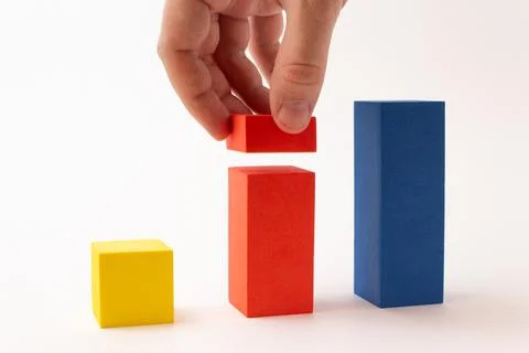 Chart from color blocks. Hand creates chart column. Stock Photos