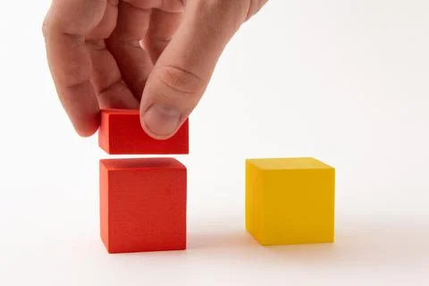Chart from color blocks. Hand creates chart column. Stock Photos