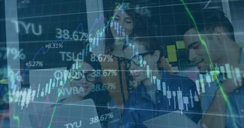 Chart overlay appearing, team gathering around laptop and tablet, pointing and Stock Photos