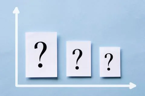 Chart with three white cards with question marks Stock Photos