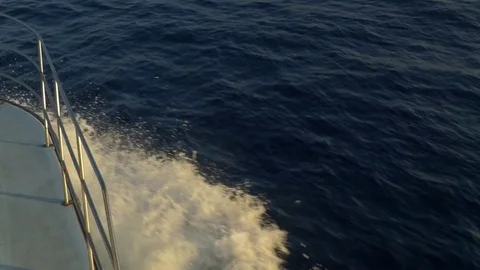 Charter boat point of view of hull and wake on the ocean Stock Footage 84809192