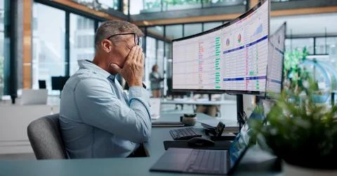 Chartered Accountant Struggles With Complex Billing Codes Late In Office. Stock Photos
