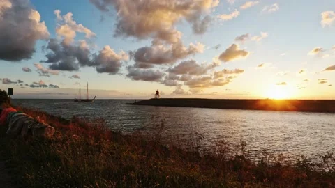 Chartership leave the harbour in sunset Stock Footage 206654233
