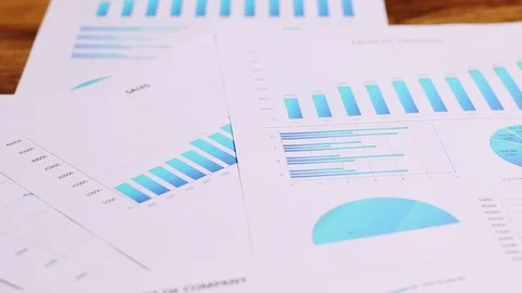 Charts and graphs are placed on the desks, data, and statistical performance  Stock Footage 94488392