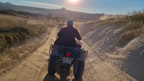 Chase the sunset on a quad ride through Cappadocia in the magical glow of dusk. Stock Footage 262889355