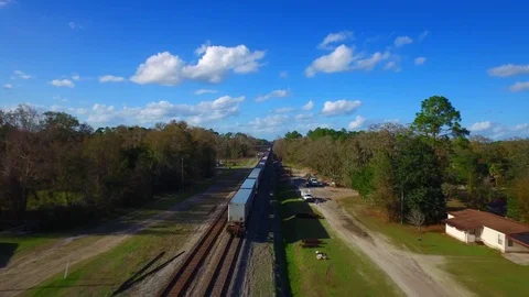 Chasing the back of a train through the folkston funnell Stock Footage 72885690