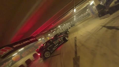 Chasing Drift: Red BMW with Accents Follows Underground Battle Stock Footage 327030613