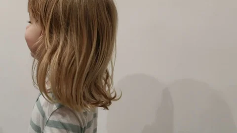 Chasing happy child running around tablecloth Stock Footage 70604372